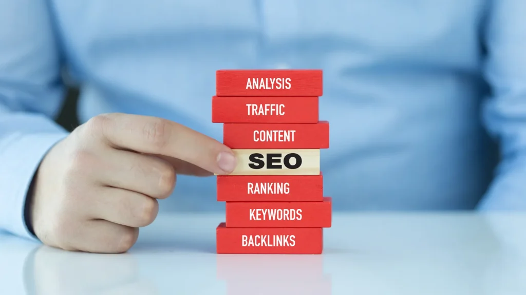 A stack of blocks with terms like 'SEO,' 'Ranking,' and 'Keywords,' symbolizing how affordable SEO services London focus on critical SEO elements to drive organic growth