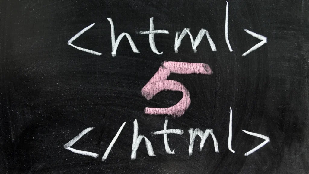 HTML5 web development services concept shown with HTML tags and number 5 written in chalk on a blackboard