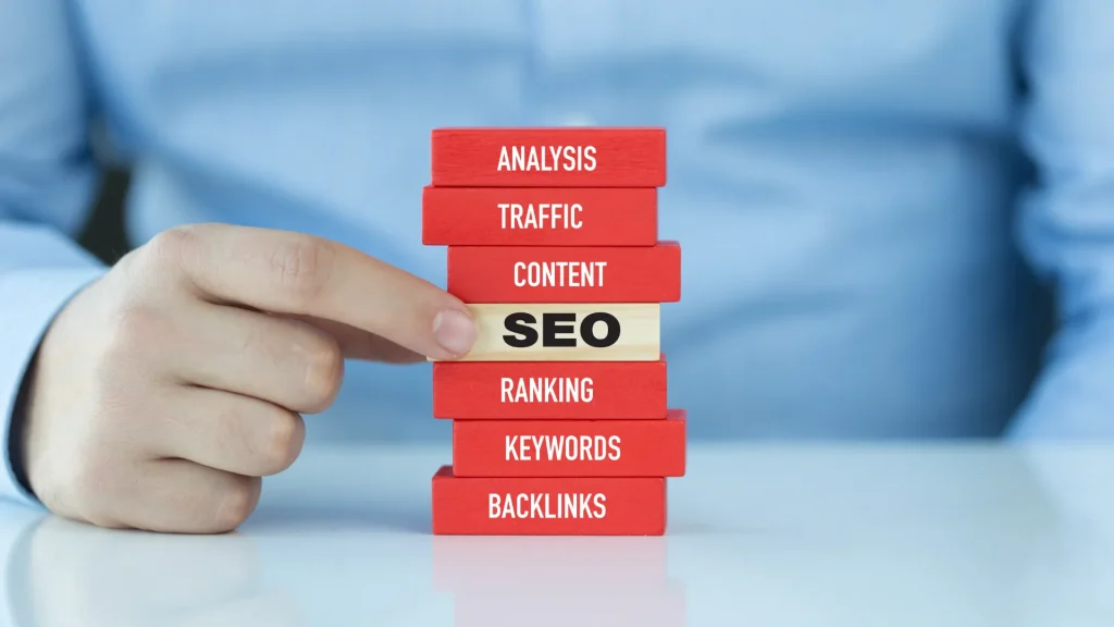 A stack of blocks with SEO-related keywords, representing the foundational elements of local SEO services for UK businesses to strengthen their digital presence